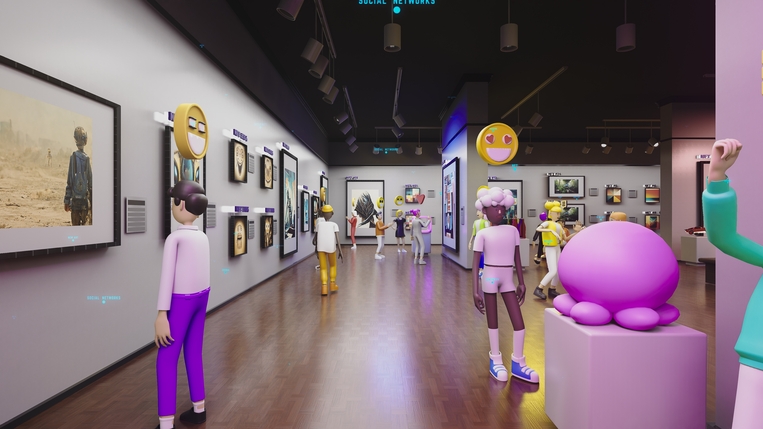 A visitor walking through a gallery of framed art